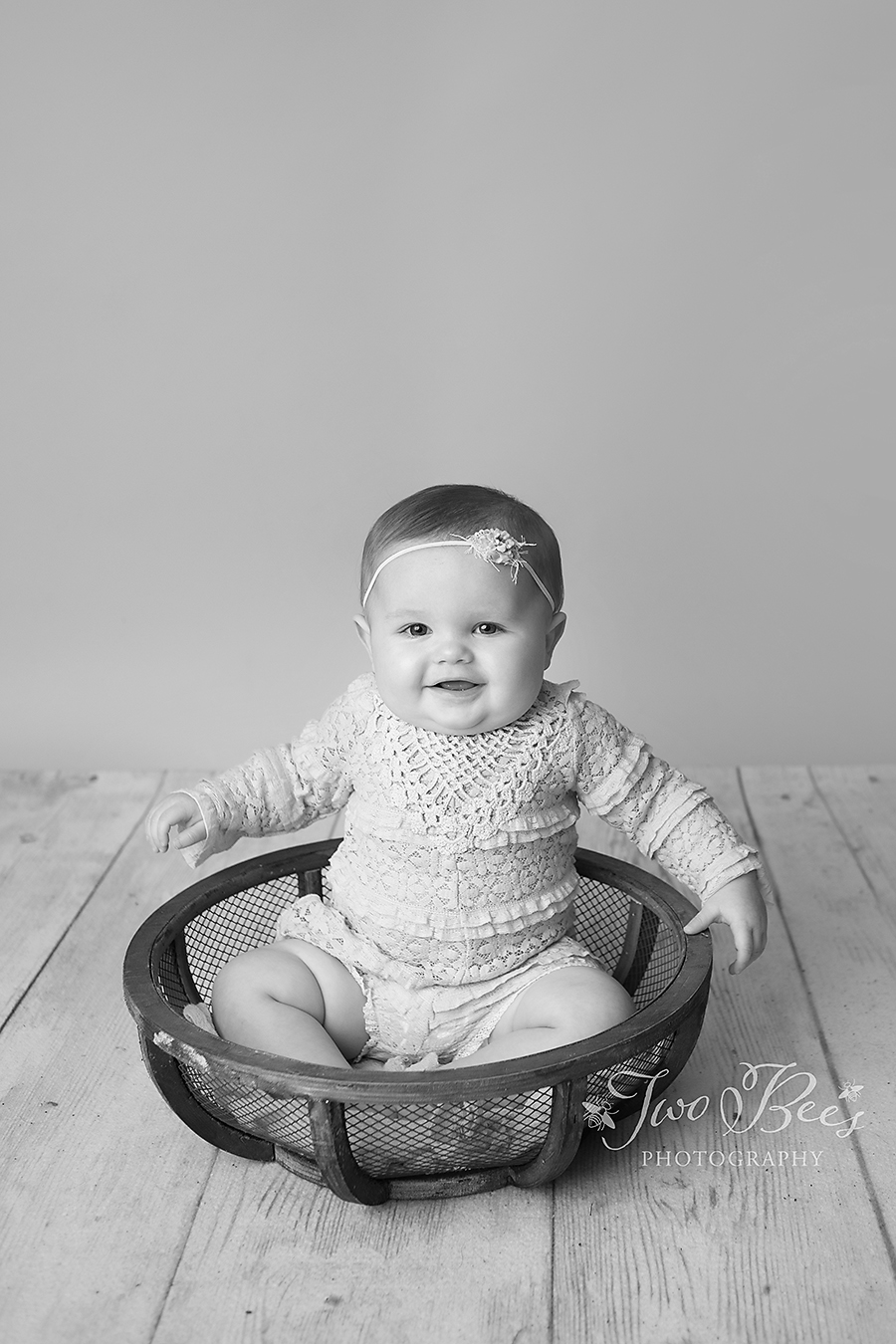 happy baby girl in basket