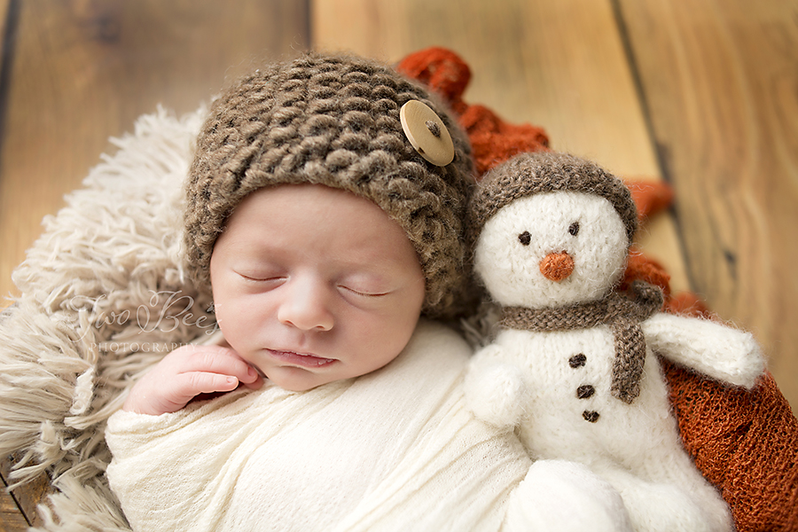 baby boy with snowman