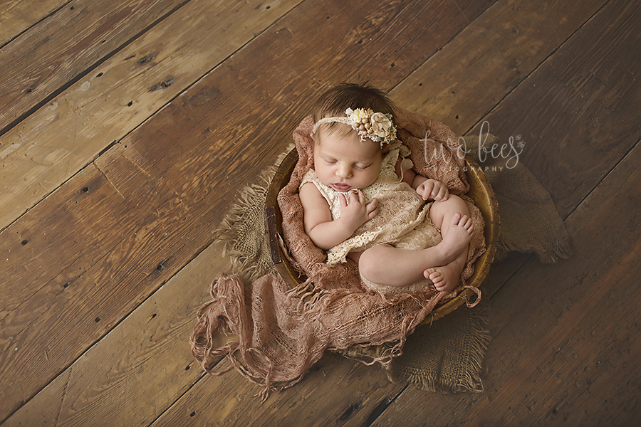 newborn baby girl on wood