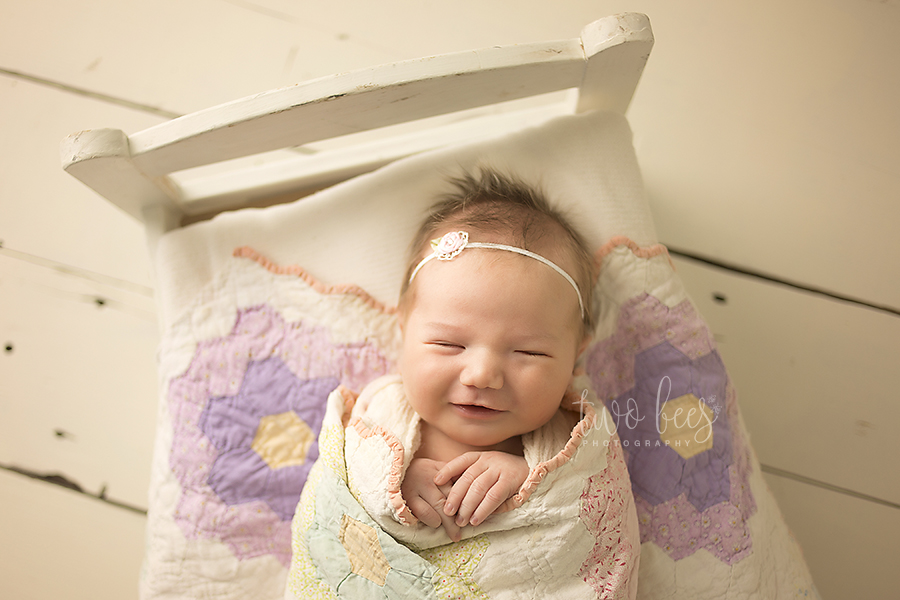 long island newborn photographers smiling baby girl