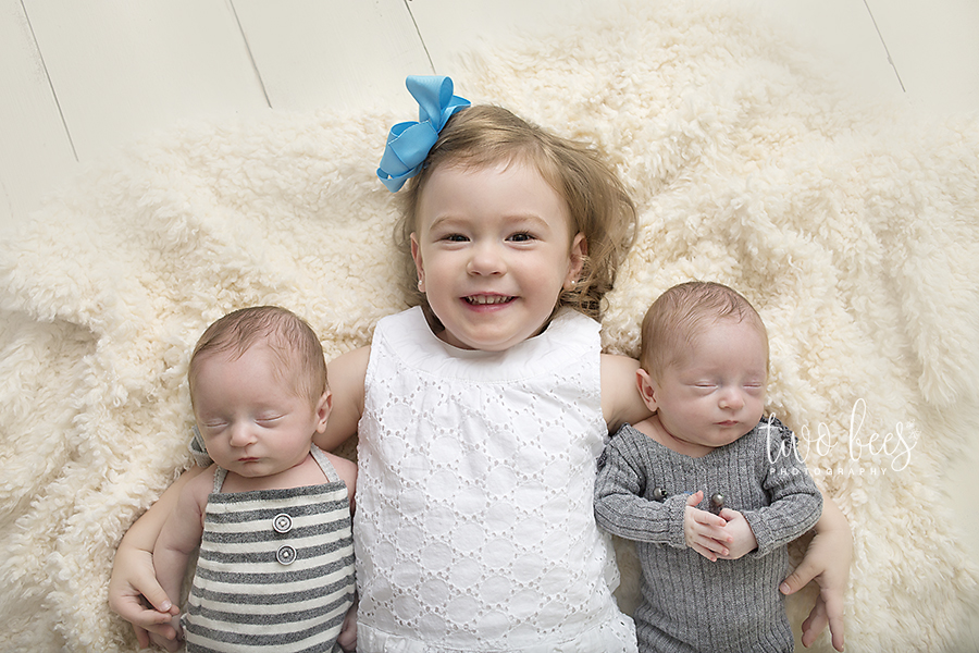 big sister with twin baby brothers newborn session